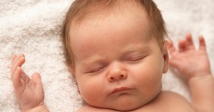 Close Up Of Baby Sleeping On Towel