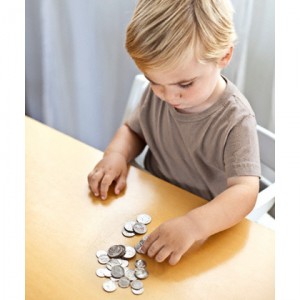 Little boy counting coins