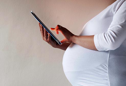 getty_rf_photo_of_pregnant_woman_using_tablet
