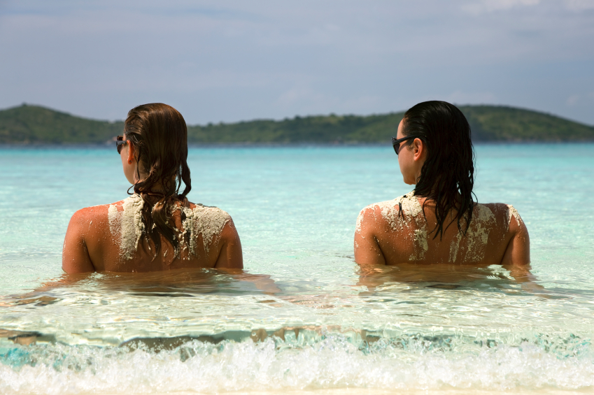 Three amazing women relaxing on the hidden beach